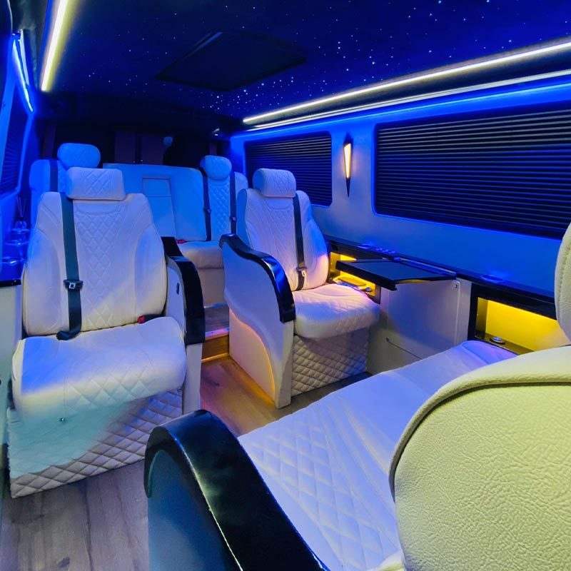 White leather seats in a VIP van