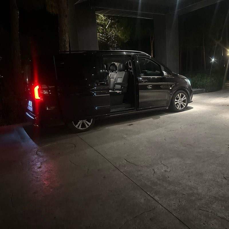 Private van with the door open for luggage